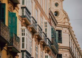 Colorful architectural facades in Málaga, Spain showcasing European heritage style.