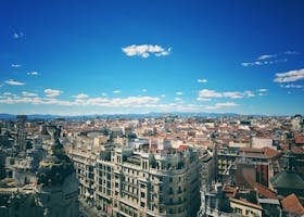 A breathtaking aerial view of Madrid's vibrant cityscape under a clear blue sky.